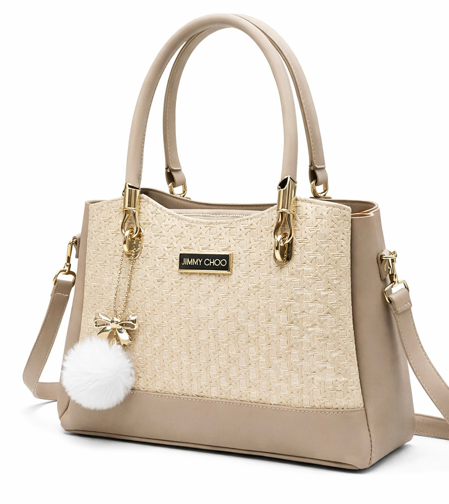 Elegant Designer Handbag with Gold Hardware & Pom-Pom Charm